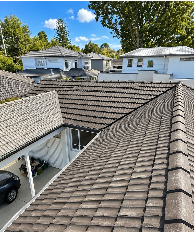 The same tiled roof cleaned back to a deep even colour, after
